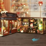 A detailed view of a Christmas wooderland diy miniature house, showcasing the creativity and craftsmanship of hobbyists. The miniature features a Santa figure, decorated trees, and festive ornaments, providing a unique and tiny festive scene