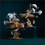Two completed 3D wooden puzzles of fantastical spaceships with intricate steampunk designs, gears, and sails.
