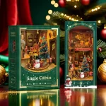 A festive DIY book nook kit featuring a Christmas-themed jingle cabin, complete with a snowman, gifts, a Christmas tree, and Santa sliding down the roof.
