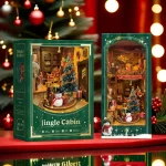 A festive DIY book nook kit featuring a Christmas-themed jingle cabin, complete with a snowman, gifts, a Christmas tree, and Santa sliding down the roof.