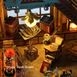 A detailed DIY miniature of a magic book store showcasing an octagonal desk, various books, a lit lamp, and other magical elements