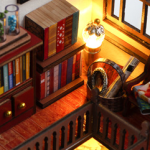A detailed DIY miniature house representing a magic book store, featuring bookshelves filled with colorful books, a lit lamp, and other charming elements.