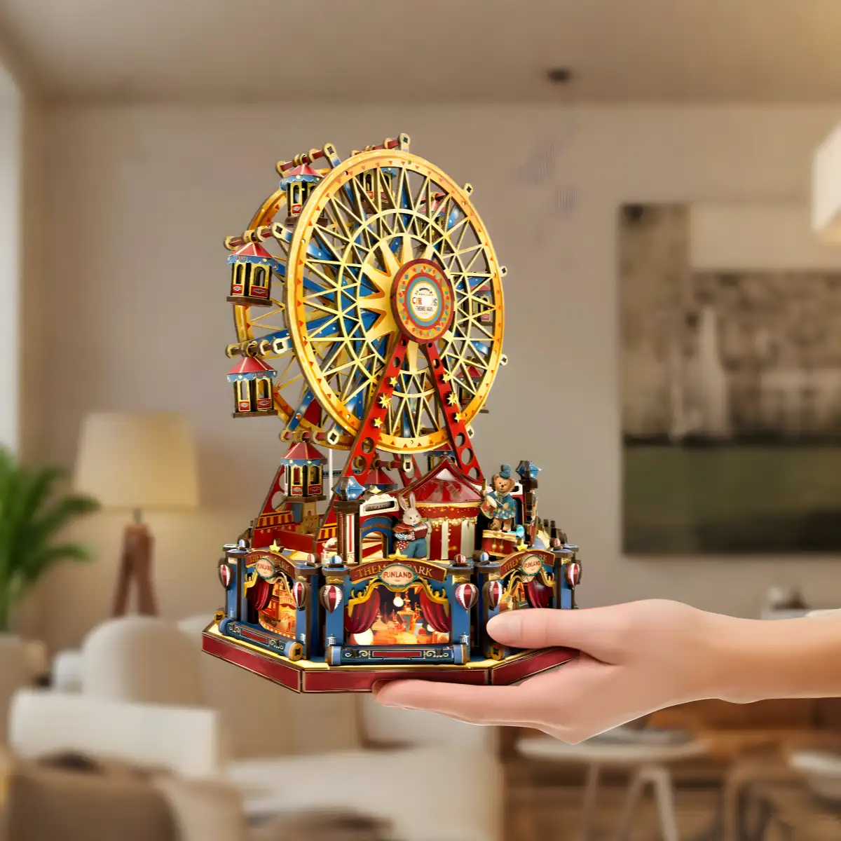A hand holding the Rofuntime Century Ferris Wheel 3D wooden puzzle, with a blurred indoor background.