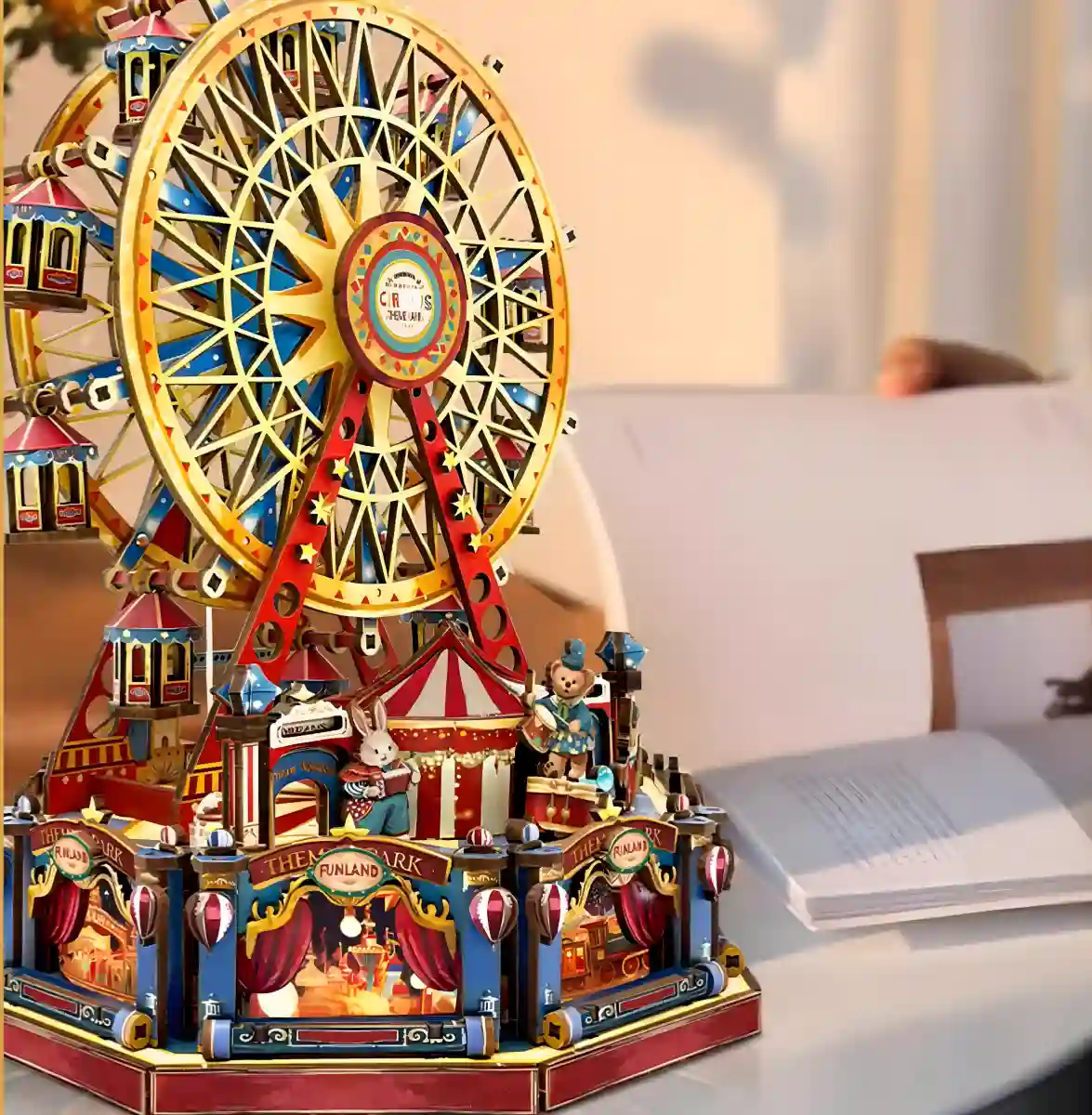 A Rofuntime Century Ferris Wheel 3D wooden puzzle in a home setting, with an open book nearby.
