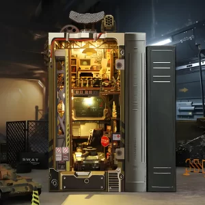 Assembled and lit Military Base DIY Book Nook Kit with an adjacent book, set amidst military-style accessories.