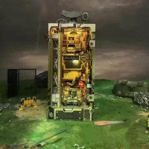 Military Base DIY Book Nook Kit with internal lights, set in an outdoor environment with green terrain and a dark sky.