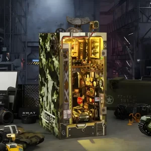 Rofuntime Military Base DIY Book Nook Kit illuminated, showing detailed interior and camouflage exterior, surrounded by military-themed items.