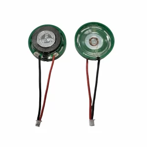 Two small, round green speakers with red and black wires are shown on a white background, ready for integration into a Mini Music Box DIY project.