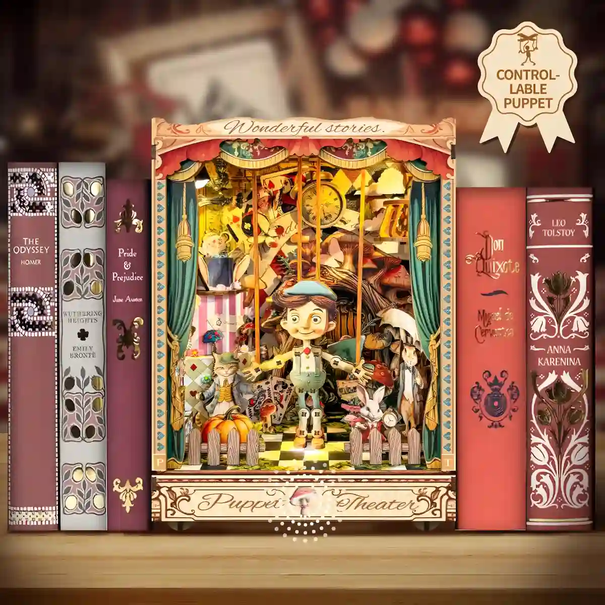 The illuminated Puppet Theater Book Nook Kit displayed between classic literature books on a shelf, with a "Controllable Puppet" badge.