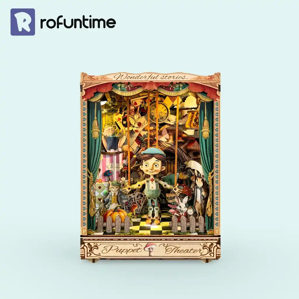 The assembled Puppet Theater Book Nook Kit against a solid light blue background, with the "Rofuntime" logo in the top left.