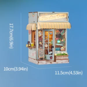 A miniature beach bar book nook kit with arrows indicating its dimensions: 17.7cm (6.9in) height, 10cm (3.94in) width, and 11.5cm (4.53in) depth.