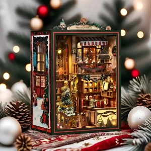Fully assembled and lit Rofuntime Christmas Shop DIY Book Nook Kit on a red plaid fabric, surrounded by Christmas ornaments and blurred lights.