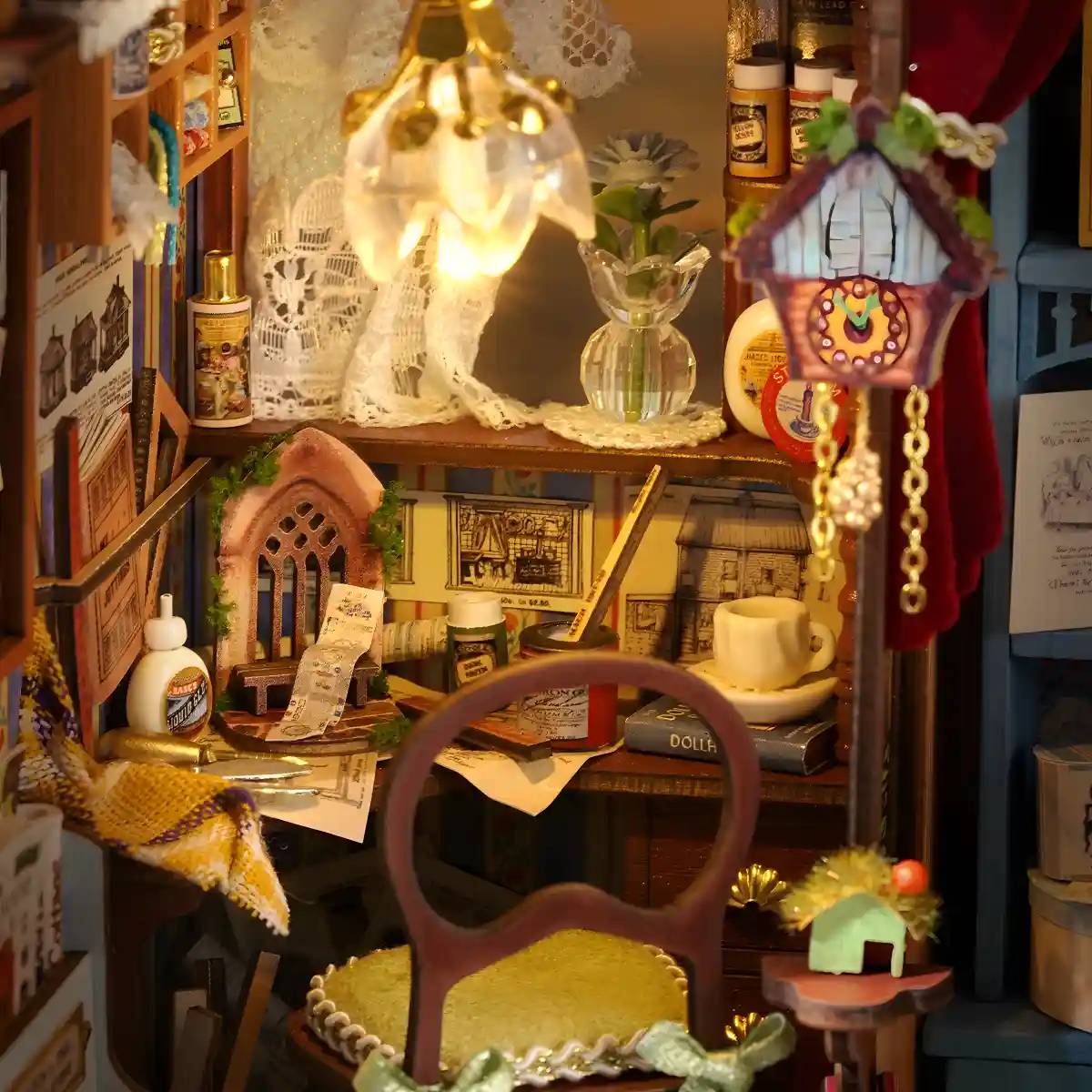 A macro shot of the miniature dollhouse workshop desk, showing a tiny chair, a half-finished craft project, a jar of glue, a small teacup, and a decorative cuckoo clock.