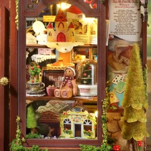 Close-up of a window display in the dollhouse, featuring a floating castle, a teddy bear with a scarf, a small pie, a snow globe, and a miniature "Three Bears General Store" below.