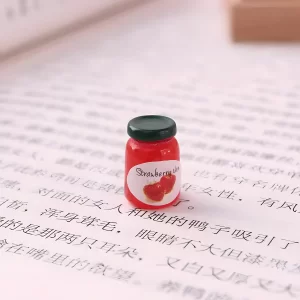 A single strawberry jam jar miniature, a red food-themed miniature.
