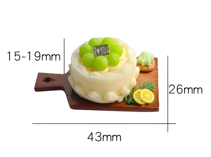 An image of a miniature green grape cake on a wooden board with measurements: cake height 15-19mm, board width 43mm, and board length 26mm.