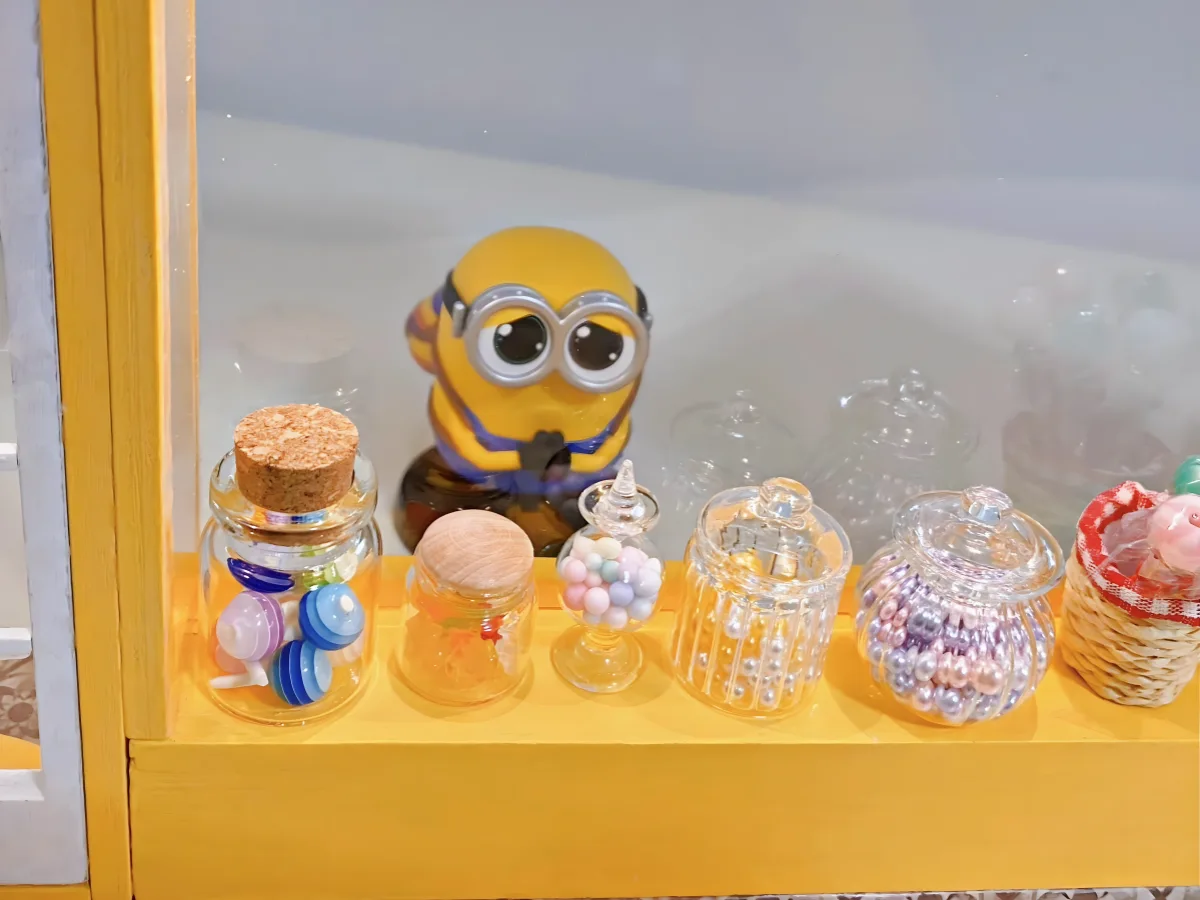Minion-themed makeover, Minion figure, miniature candy jars, storefront display, The Sweet House DIY Miniature Dollhouse Kit.