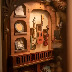 Close-up of The Secret Rhythm book nook with miniature guitars and a violin on display.
