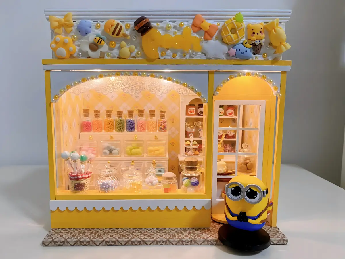 Final DIY miniature dollhouse makeover, The Sweet House kit, lighted facade, Minion theme, candy house DIY transformation.