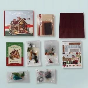 Rofuntime Warm Christmas Lodge DIY kit parts, including instructions, fabric, and other accessories.