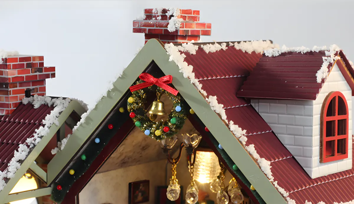 DIY Christmas miniature rooftop with a wreath and snow.