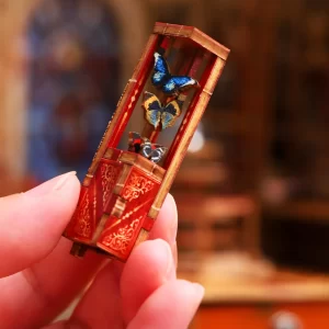 Holding miniature butterfly case, detailed Rofuntime book nook kit.