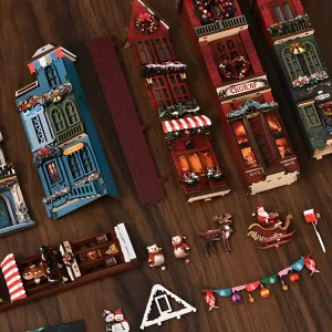 Individual miniature pieces of a Christmas Street Corner book nook, including Santa and reindeer.