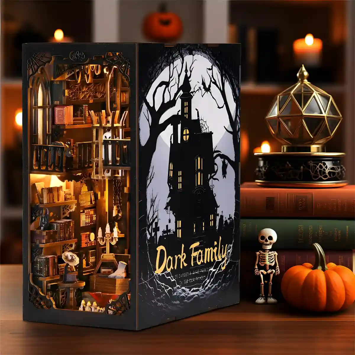Dark Family DIY Book Nook Kit on a bookshelf, a gothic miniature house with warm light.