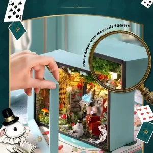 A hand opening the magnetic frame of the Dream Moment DIY miniature kit to show the scene within.