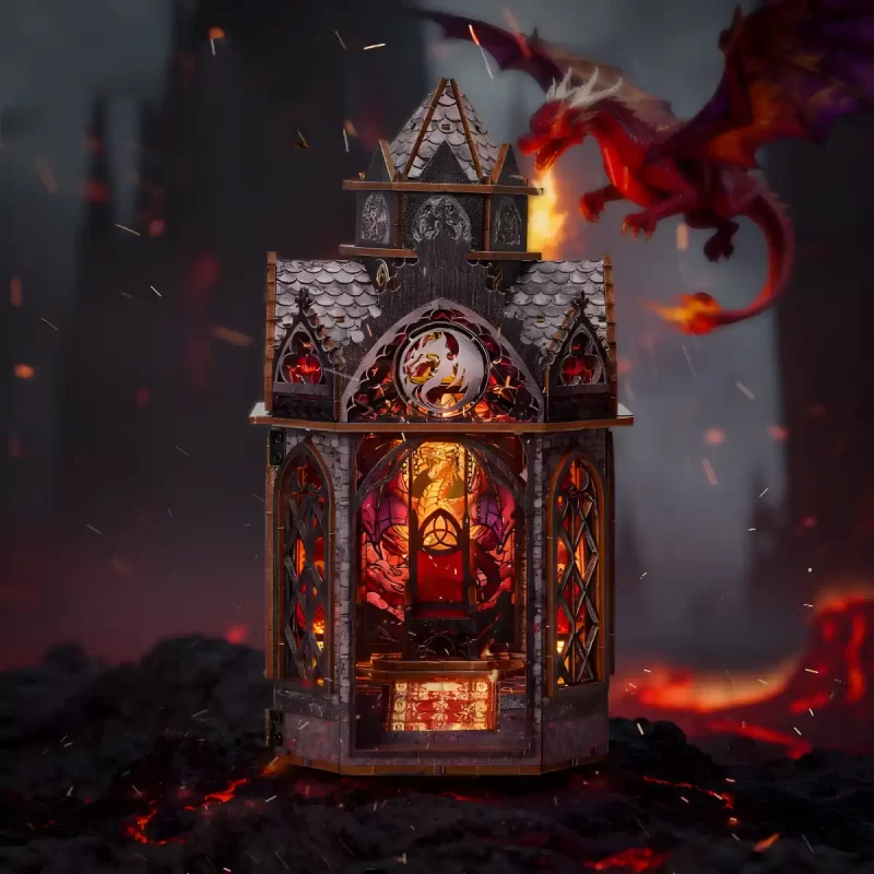 Front view of the illuminated Spire of the Wyrm book nook with a fierce flying dragon backdrop.