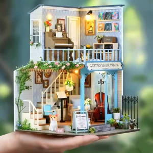 Handmade gift, DIY dollhouse kit, artistic dollhouse, held in hand.