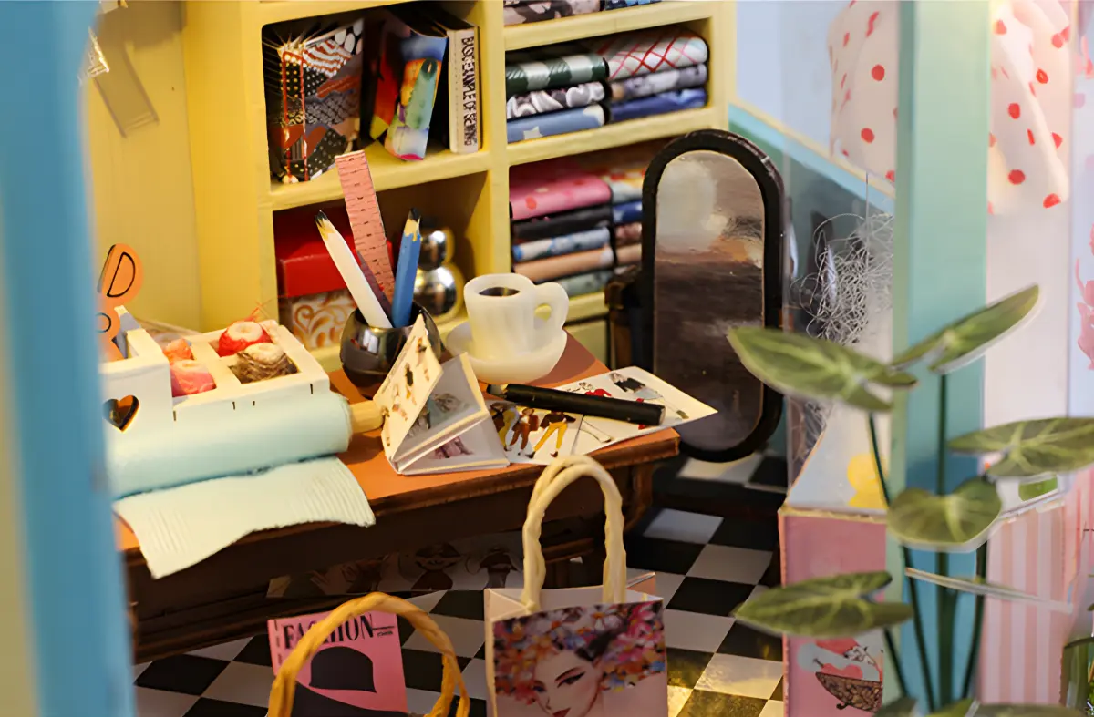 Miniature Tailor Shop dollhouse worktable, vintage cozy sewing machine, slow-living DIY craft scene.