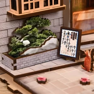 Nostalgic Japanese street miniature with signboard, greenery, and a cat.