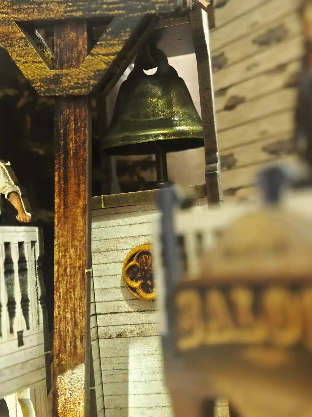 Close-up of the town bell in the high-noon book nook miniature kit.