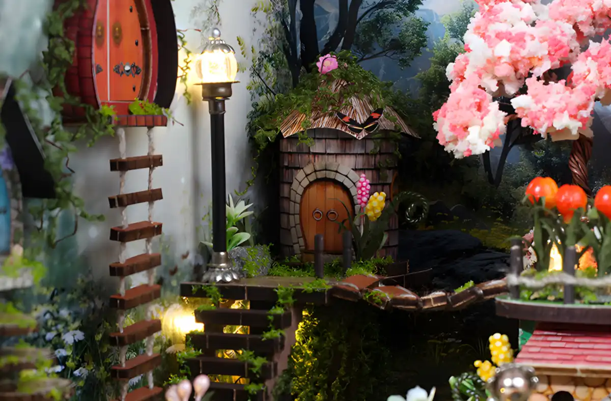 Close-up of two miniature cottages, highlighting intricate natural landscapes.
