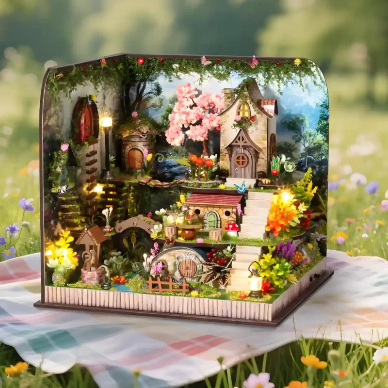 Assembled Whispering Woods kit displayed outdoors on a picnic blanket.