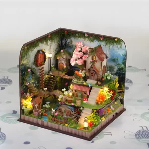 Side view of DIY miniature dollhouse kit displaying fairy-tale forest setting.
