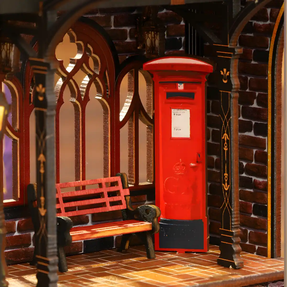 Close-up of a vintage red mailbox and bench in the Zero Platform book nook.