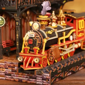 Illuminated steam train miniature on tracks in the Zero Platform book nook.