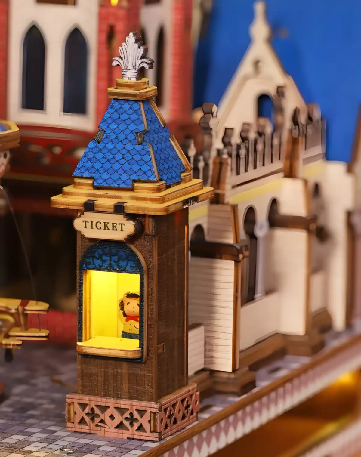 Illuminated Miniature World detail: a small, quaint ticket booth of the Annecy Castle model.