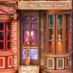Close-up of the "Magic Pharmacy Room," a detailed wizard shop in the DIY book nook featuring glowing wands and a magical swirling door.