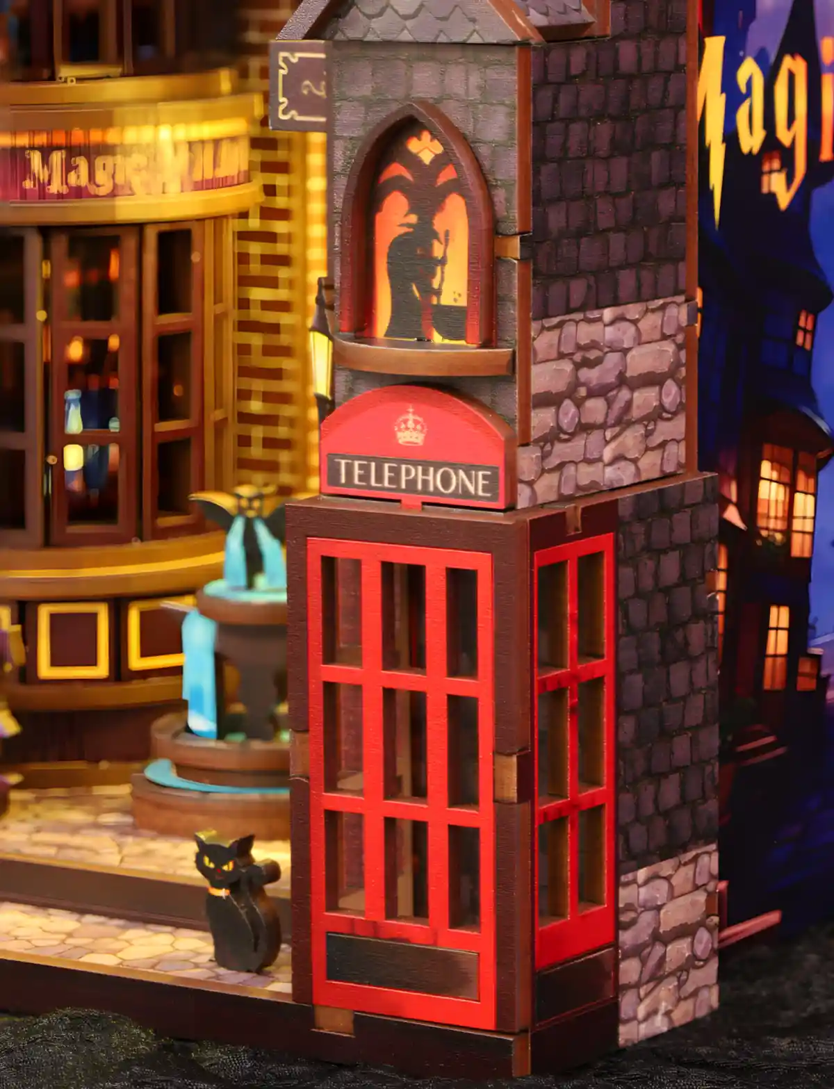 A red telephone booth in the Magic Alley book nook, featuring a glowing wizard silhouette and gothic details for a magical atmosphere.