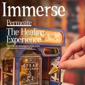 A hand assembling The Dainty Steeper book nook, highlighting the immersive DIY book nook kit experience.