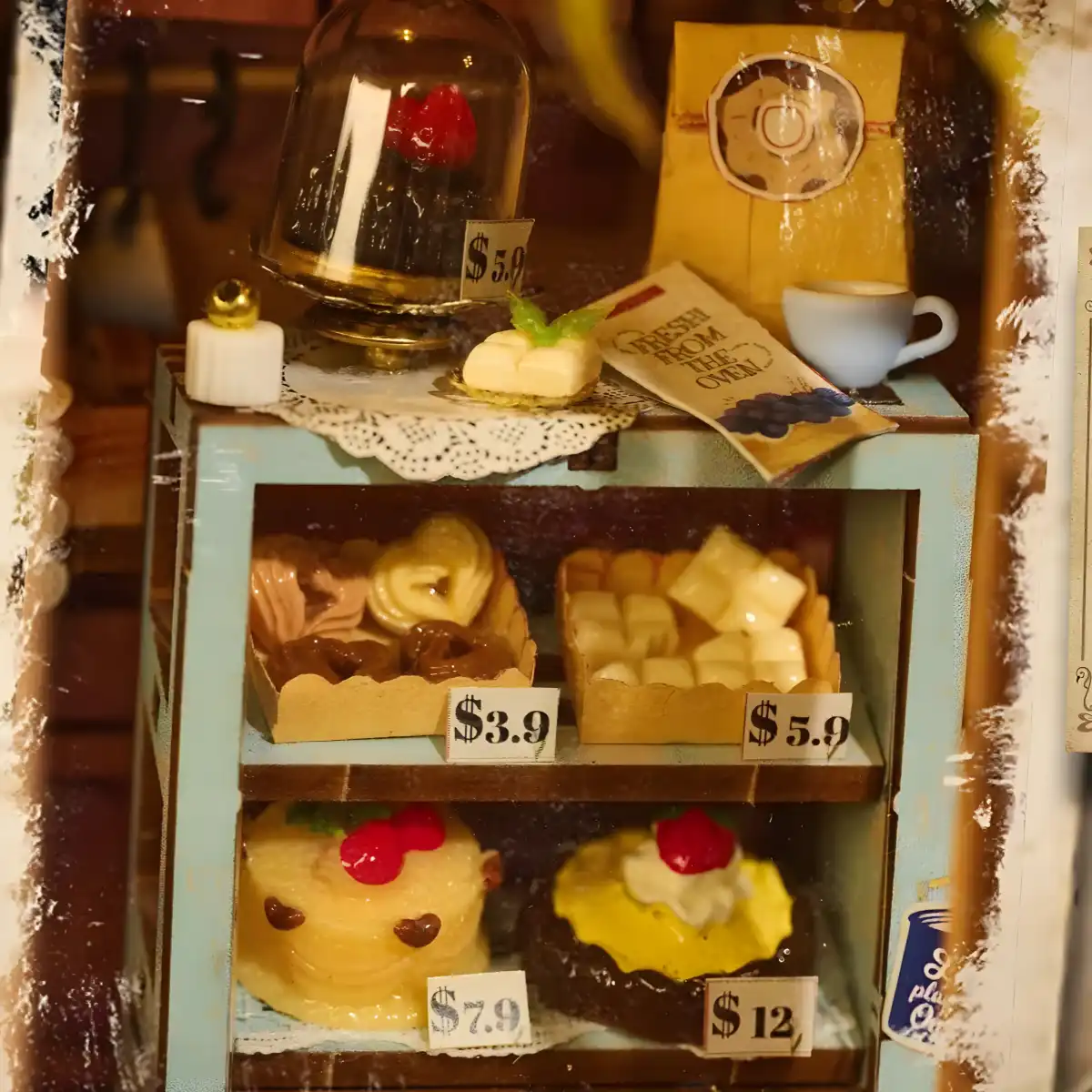 Detailed dessert showcase in The Dainty Steeper book nook, a British lifestyle miniature with tiny cakes.