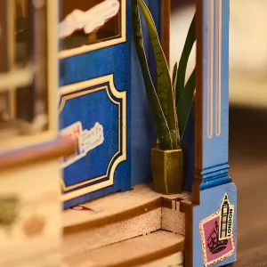 Entrance steps, The Dainty Steeper book nook, with small plant pot and London sticker.