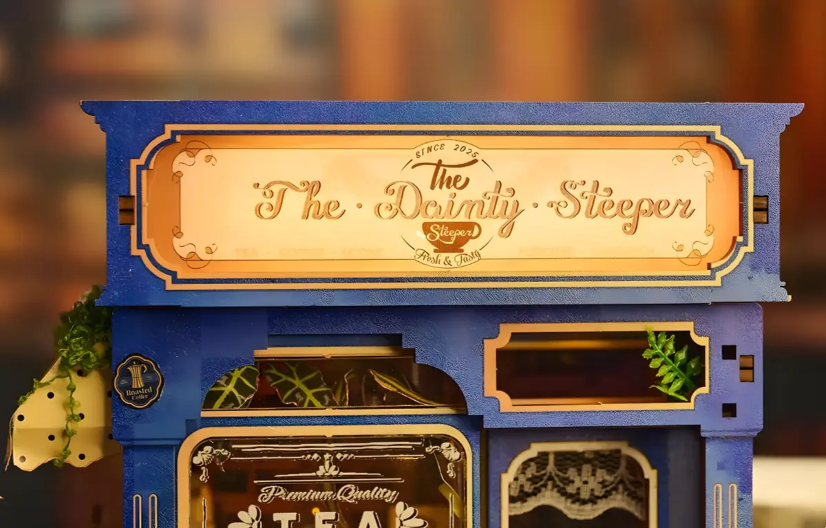 The Dainty Steeper sign, wooden blue facade, detail of the English vintage tea shop.