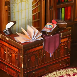 An ornate miniature desk inside the World Bookstore DIY Book Nook Kit, a detailed vintage European bookstore scene.