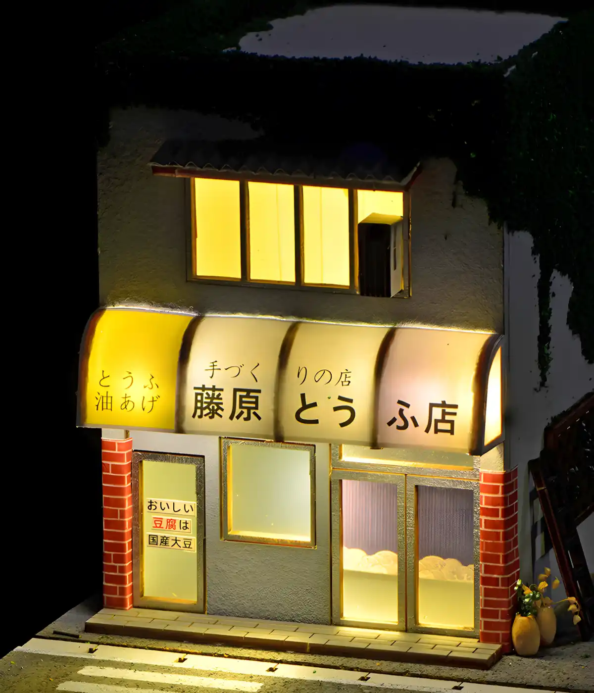 Night close-up, illuminated Fujiwara Tofu Shop Replica, warm LED lighting effect.