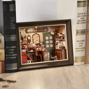 Mail Gift Cottage book nook displayed between books, a perfect DIY Bookshelf Insert.