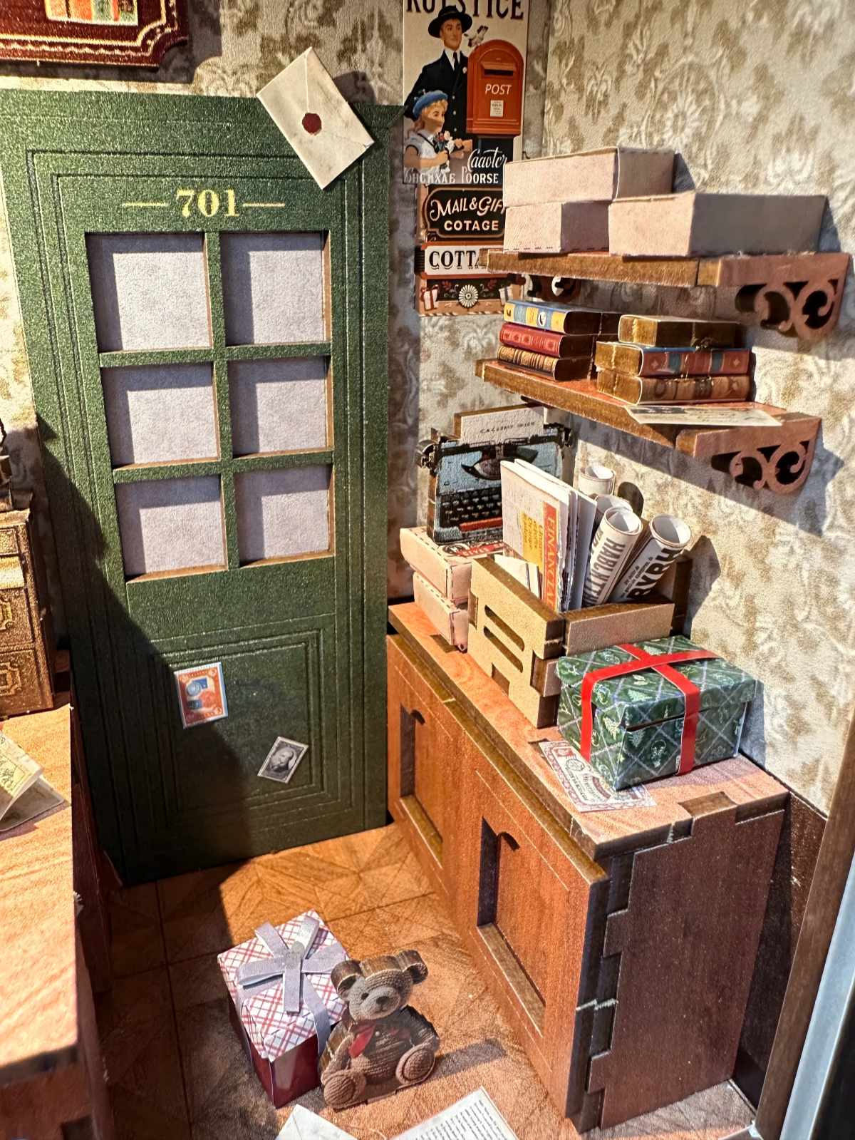 Close-up of Vintage Post Office Book Nook shelves, door, and tiny teddy bear.